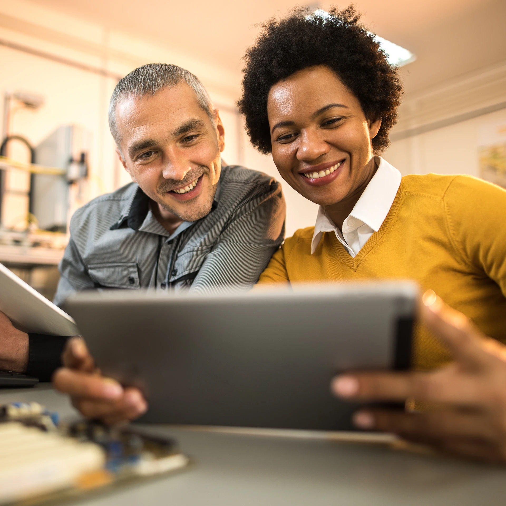man and woman looking at laptop together